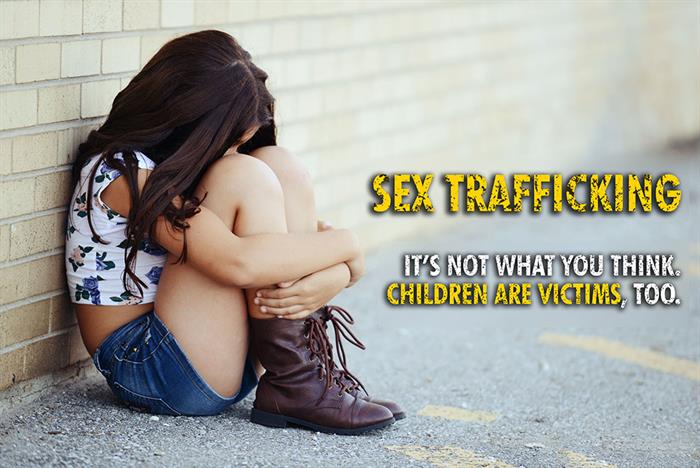 Photo of girl sitting against a wall with the words Sex Trafficking. It's not what you think. Children are victims, too.