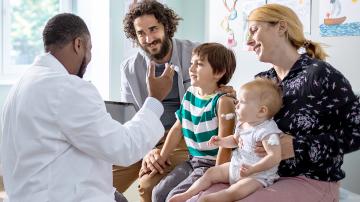 Family talking to doctor in doctor's office